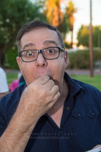 Anthony Tilli enjoying a cheese roll from Sue Clarke New Zealand temptations